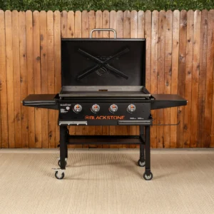 The full Blackstone 36 inch griddle cooking station shown with its hinged hood, front shelf, and four burners.